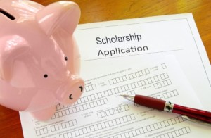 Blank scholarship application form with piggy bank